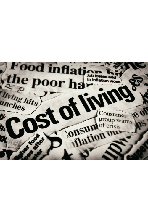 A pile of newspapers showing the cost of living and lifestyle creep.