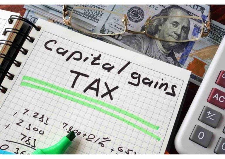 capital gains tax with a notepad and calculator